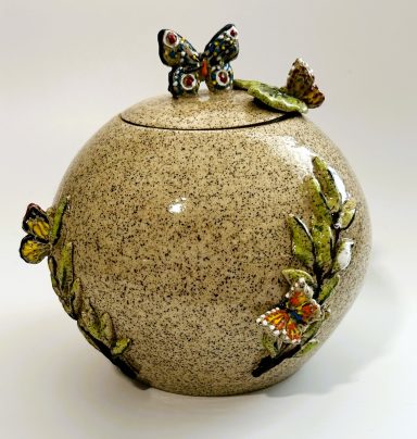 Speckled clay base. Hand painted lidded moon vase. Butterfly and vine 3D appliques. Clear glaze coating. H-6in x Diameter-6in.